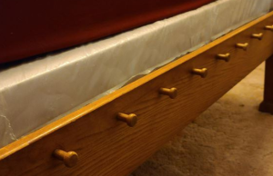 What Are These Pegs at the End of My Bed Used For?