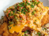 Fried Catfish Over Dirty Rice with Cajun Crawfish Cream Sauce
