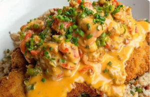 Fried Catfish Over Dirty Rice with Cajun Crawfish Cream Sauce