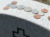 The Meaning Behind the Tradition of Coins on Gravestones