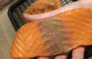 This Is Why Your Defrosted Salmon Has Yellow on It